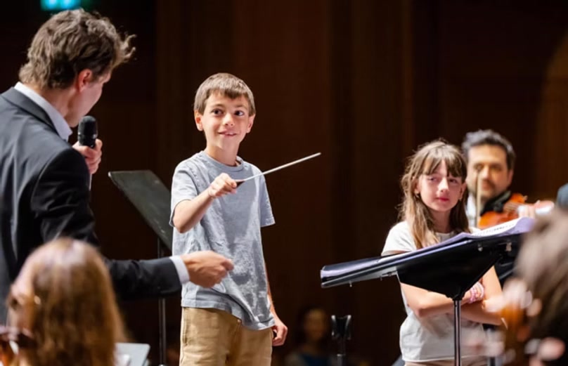 Young conductor with baton
